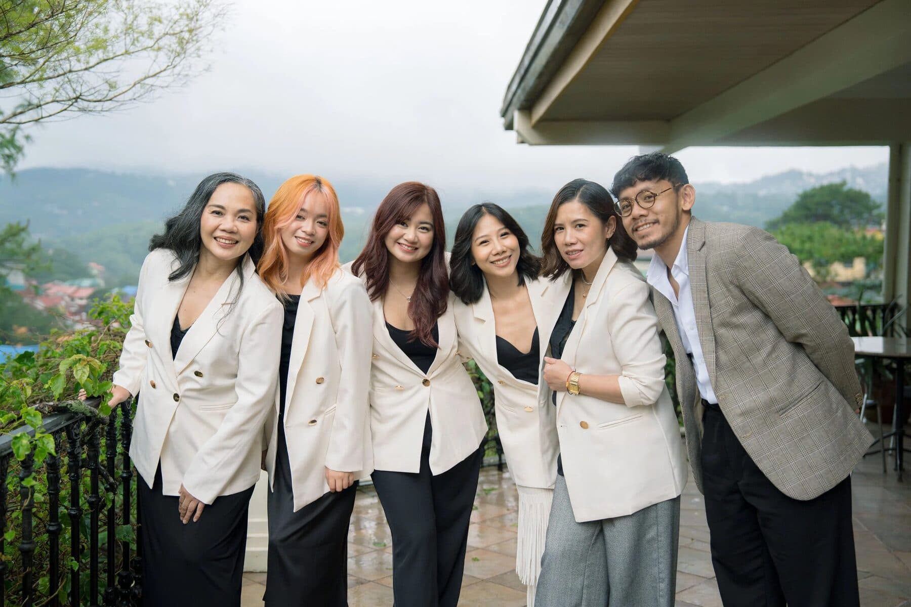 The Unco & Co planning team together on a terrace in Baguio